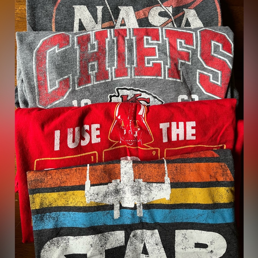 4 graphic t-shirt bundle, sizes between youth XL and adult small.
